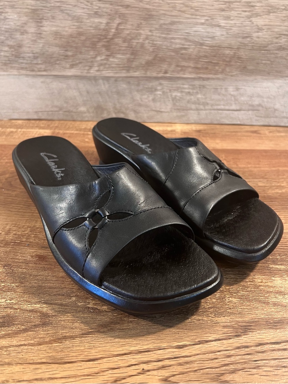 Clarks Black Leather Slide Sandals with Petal Cutouts